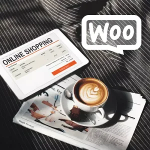 online shopping website on the tablet screen with a newspaper and cup of coffee at the table